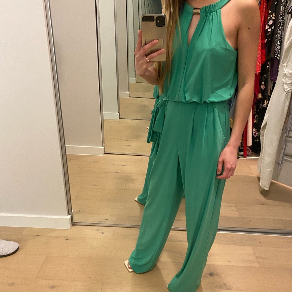 Green jumpsuit with gold accent